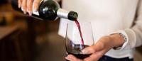 woman pouring a glass of wine